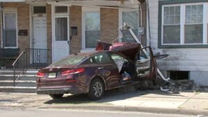 Car heavily damaged after slamming into Trenton, New Jersey home